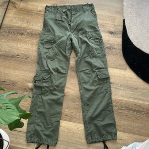 Army surplus store cargo jeans. Unisex size 27-31 waist. Adjustable sides